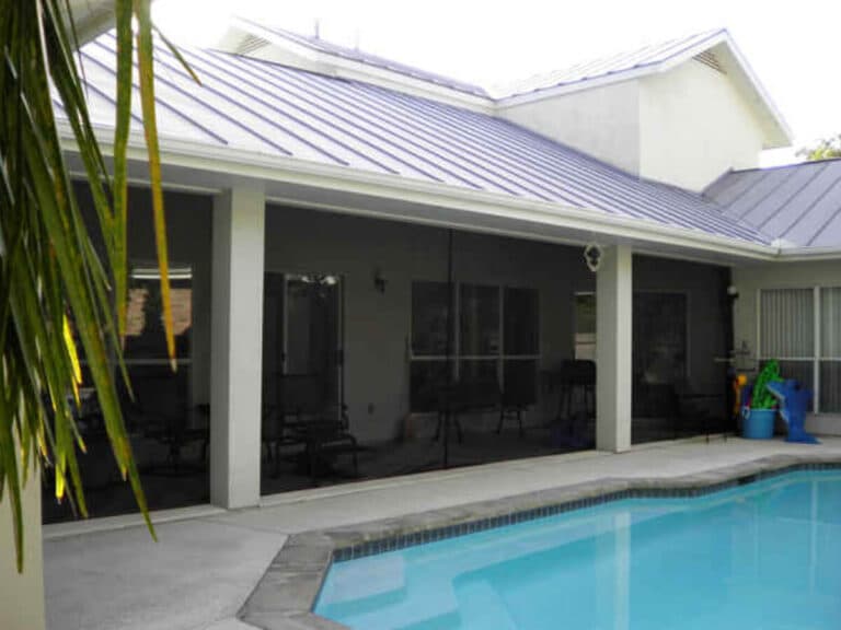 Poolside covered lanai fitted with full-height black screen panels